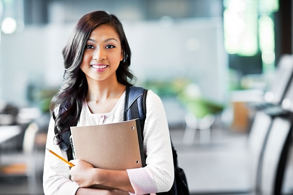 student-with-notepad-pencil-backpack.jpg