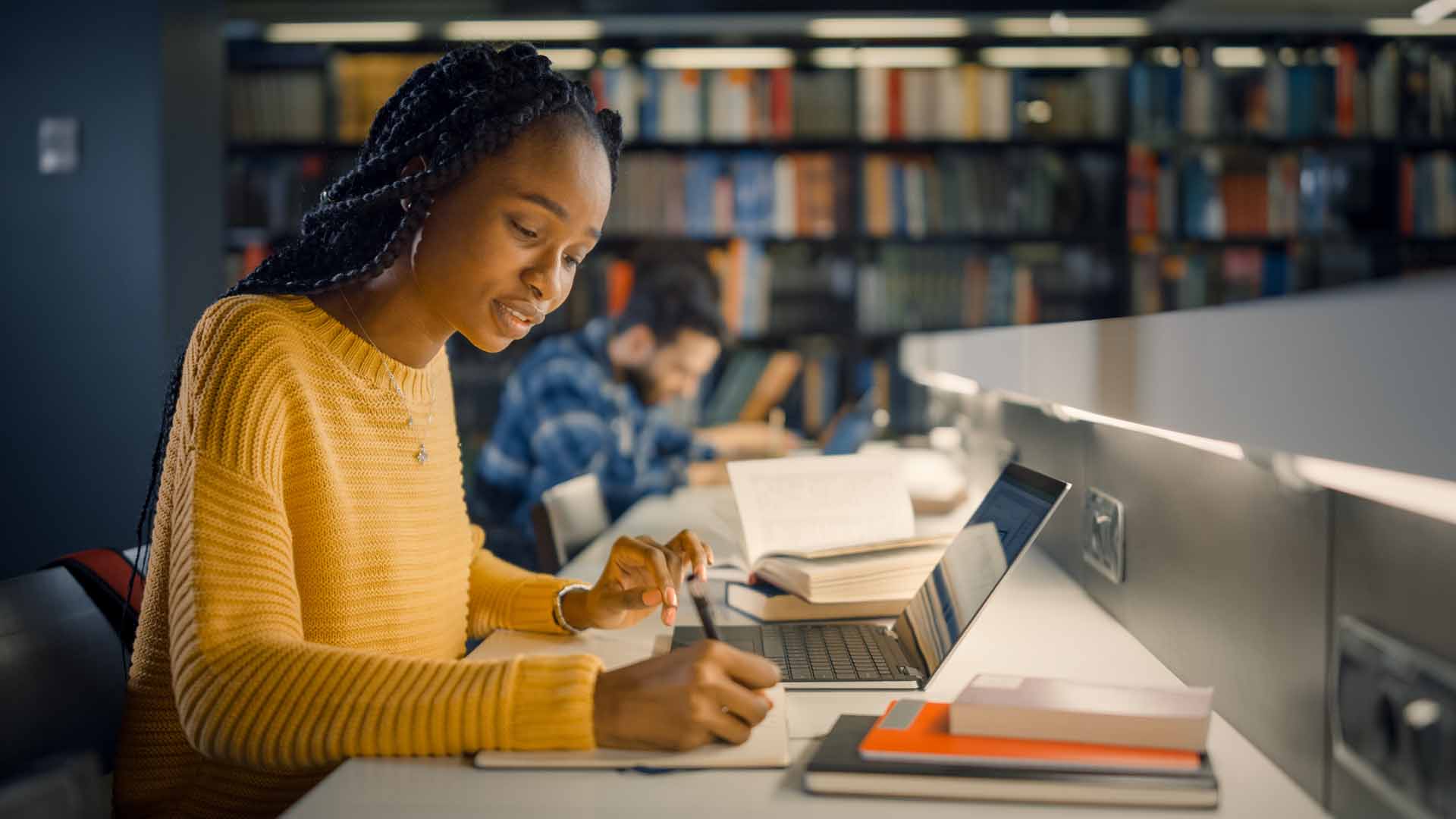 girl_sitting_at_library_desk.jpg