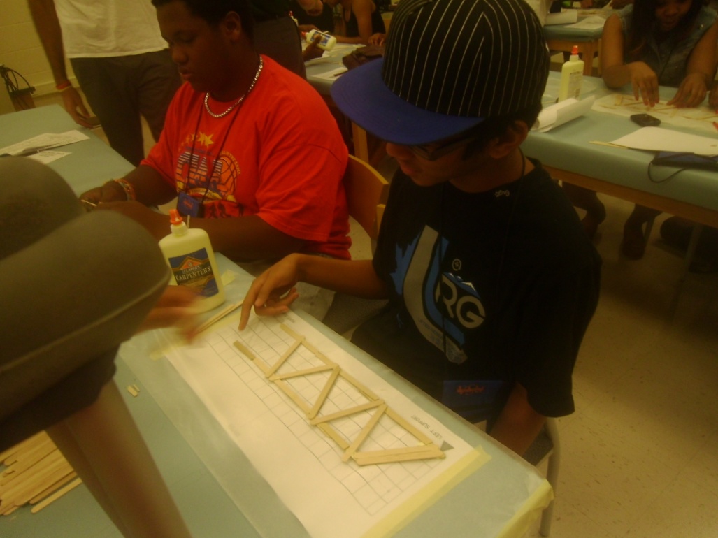 students building bridge using structural analysis