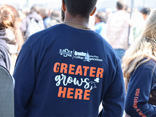 Greater grows here long sleeve shirt back view of student
