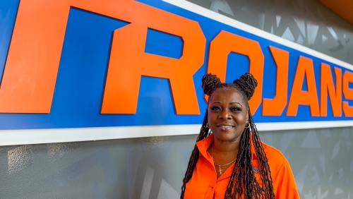 Patrina Ross in front of Trojans sign on campus